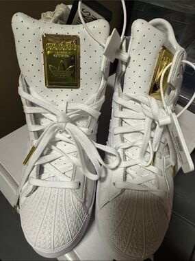 adidas White High-Top Sneakers with Gold Accents